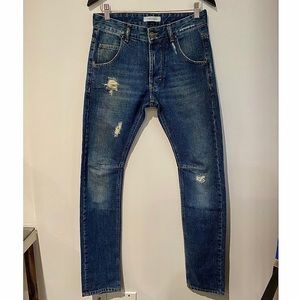 Balmain distressed denim jeans w/ zipper pockets